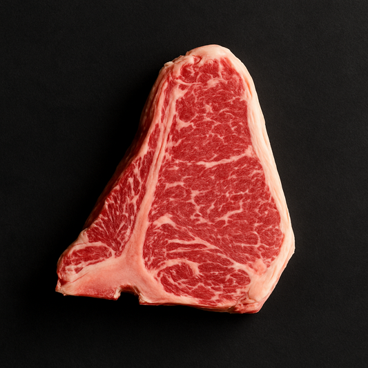 Raw Angus shortloin MB3+, boneless with visible marbling and trimmed fat cap, placed on butcher tray