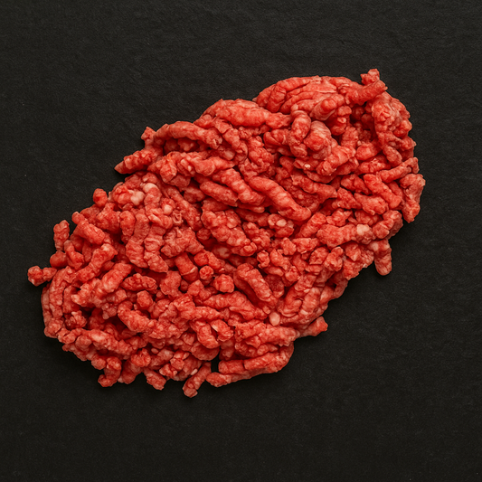 Raw premium Angus minced beef, finely ground with moderate marbling and deep red color, arranged on butcher tray